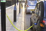 Stock image of electric car cbeing charged