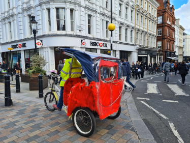 Pedicab on pavement in Westminster