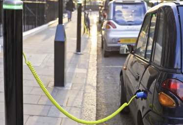 Stock image of electric car cbeing charged